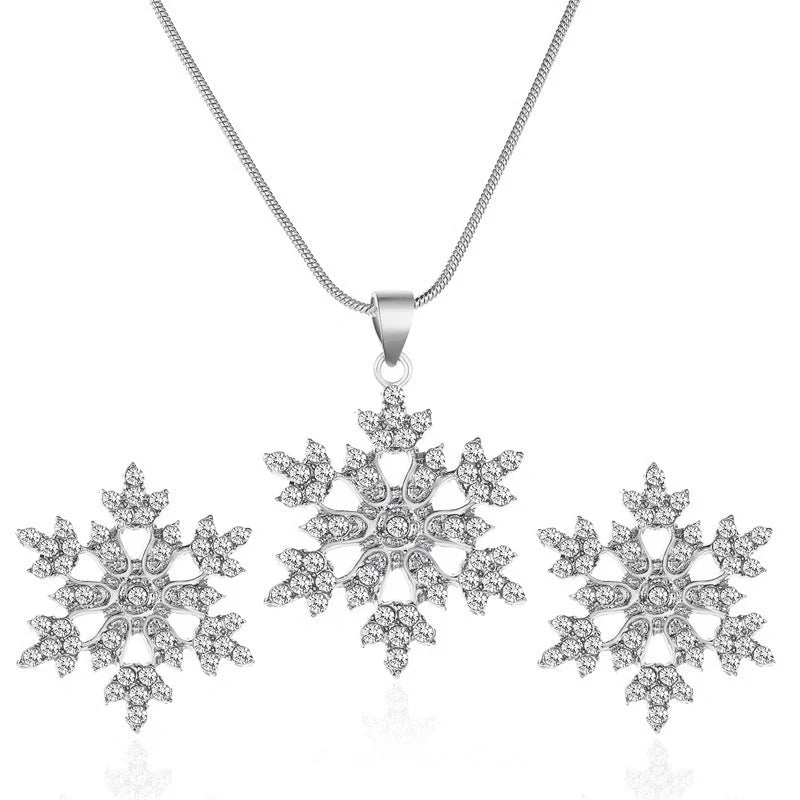 Elegant snowflake jewellery set with necklace, earrings and pendant in gold and silver tones