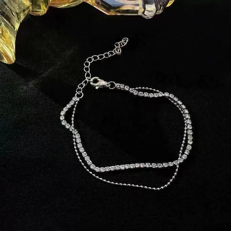 Stylish multi-layer beaded anklet necklace set with a geometric design in gold and silver tones