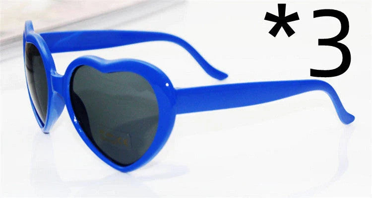 Stylish heart-shaped sunglasses with unique lens design that transforms light into enchanting special effects