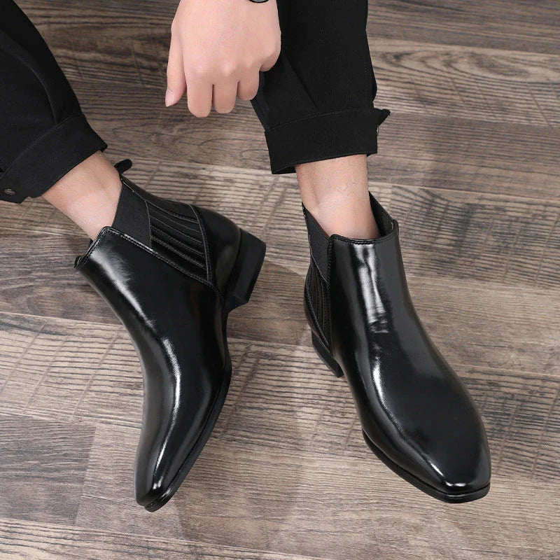 Stylish pointed toe Chelsea boots for men in black and brown colors, featuring a square heel and British-inspired design.