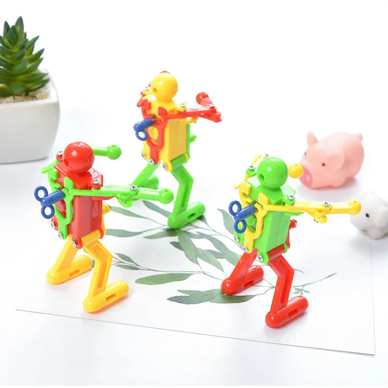 Clockwork wind-up toy robot performing captivating gymnastics display