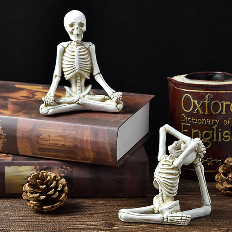 Haunting Halloween desktop ornaments, featuring intricate resin skulls and skeletons in black and vintage white finishes