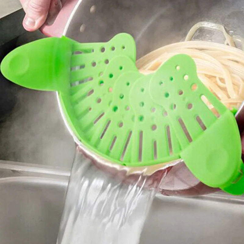 Universal Silicone Clip-on Pan Pot Strainer in purple and green, showcasing its compact design and clip mechanism