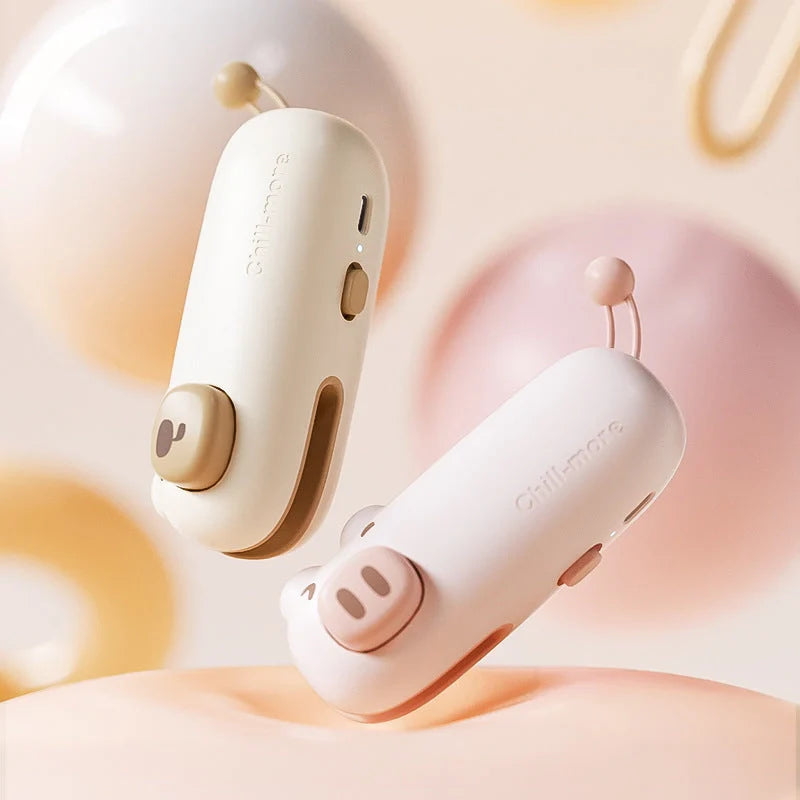 A compact, rechargeable bag sealer with a unique cartoon design, perfect for preserving food freshness at home or on the go.