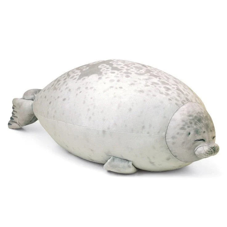 A plush, soft, and cuddly grey or white seal-shaped cushion with a detailed, lifelike design