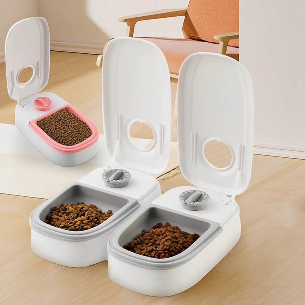Automatic pet feeder made of durable plastic and stainless steel, designed to dispense consistent meals for cats and dogs without electricity