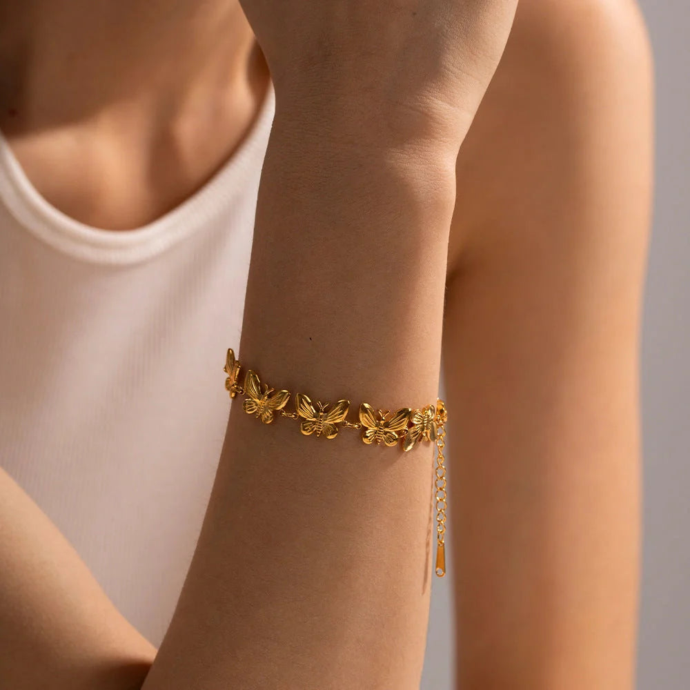 Elegant stainless steel butterfly bracelet with delicate design, available in various colours for UK women's fashion accessories