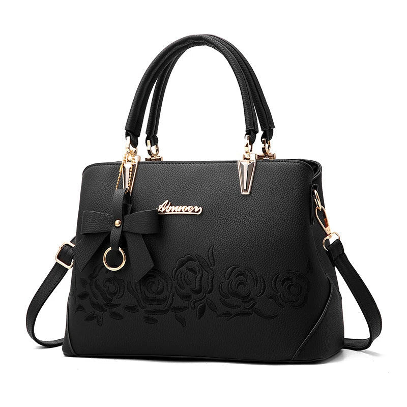 Stylish faux leather ladies' handbag in various colours, featuring a versatile single shoulder design and spacious interior