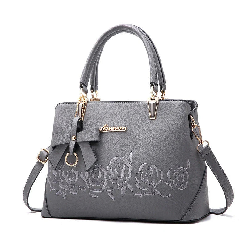 Stylish faux leather ladies' handbag in various colours, featuring a versatile single shoulder design and spacious interior