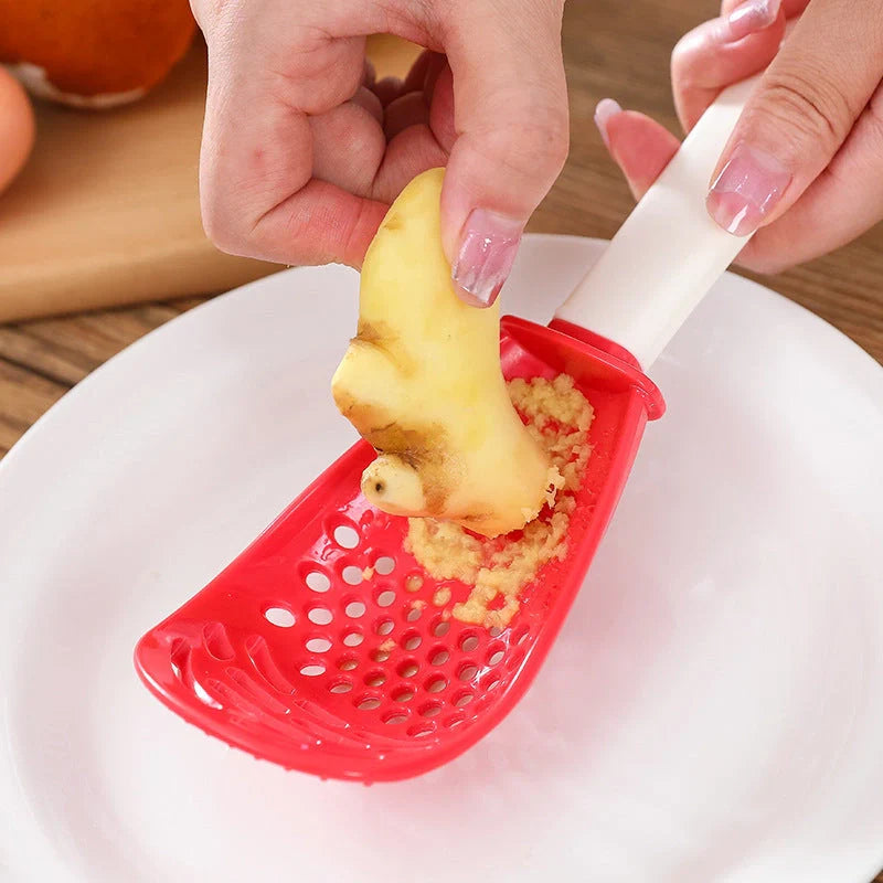 Versatile kitchen spoon for grinding, pressing, and stir-frying in red and black