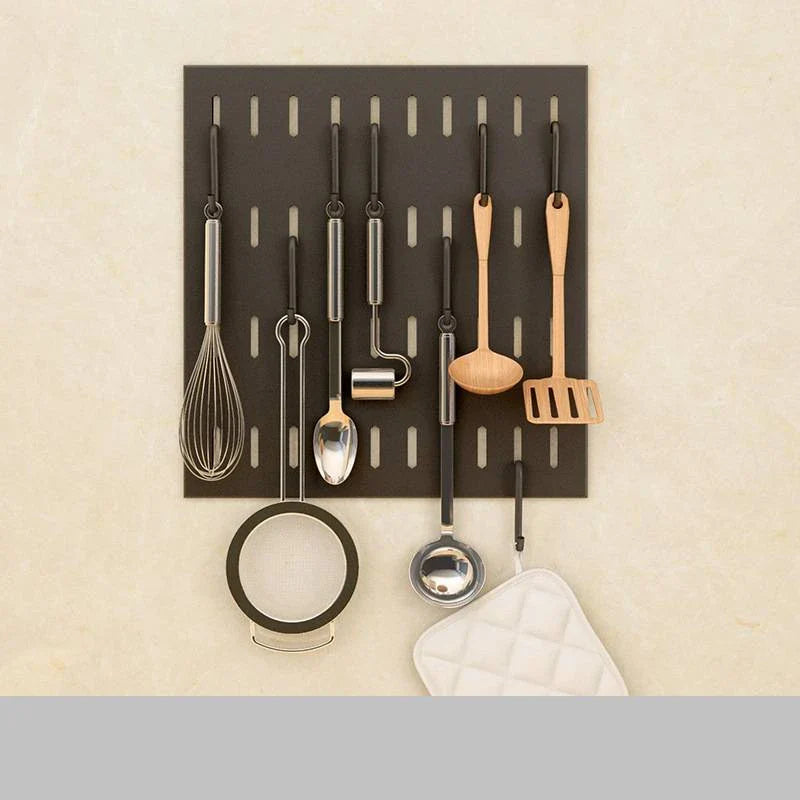 A high-quality stainless steel wall-mounted kitchen storage rack with a perforated design for customisable storage