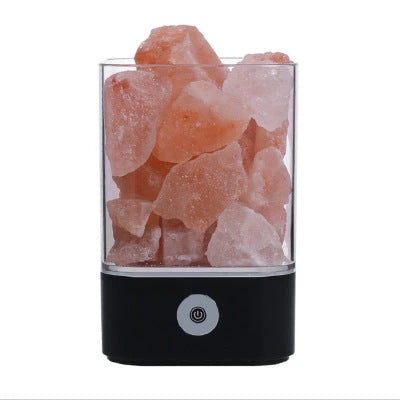 Himalayan salt lamp with warm, amber glow and adjustable lighting settings