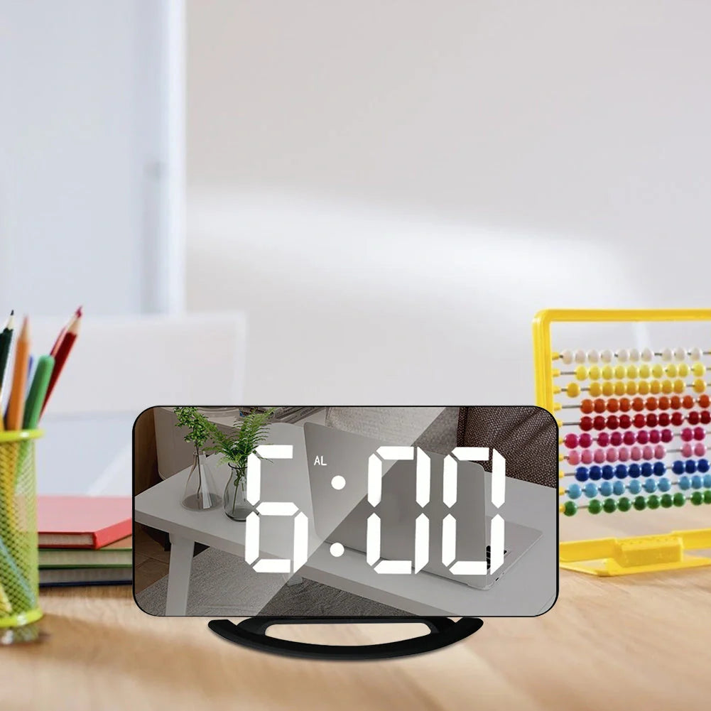 Digital mirror clock with LED display and dual USB ports on a desk