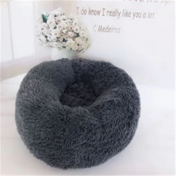 Cosy round plush cat mattress for winter warmth, available in various colours and sizes