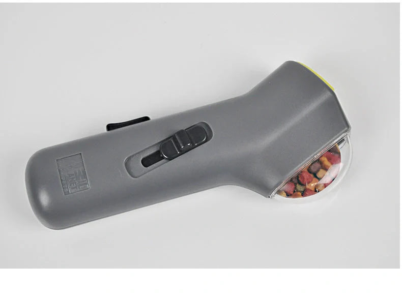 Dog Training Snack Launcher in grey, compact design for interactive pet play