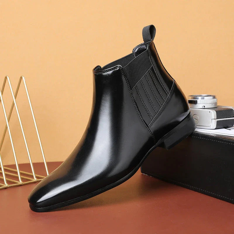 Stylish pointed toe Chelsea boots for men in black and brown colors, featuring a square heel and British-inspired design.