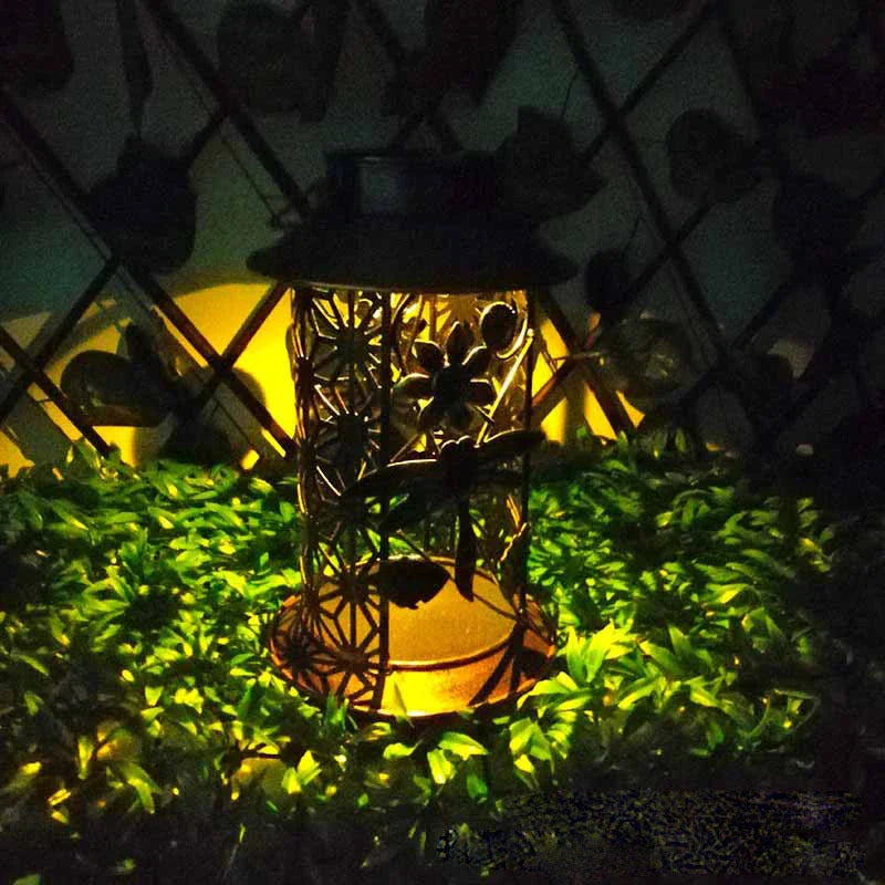 Decorative solar-powered garden lamp with iron construction and classic European design for outdoor lighting and decor