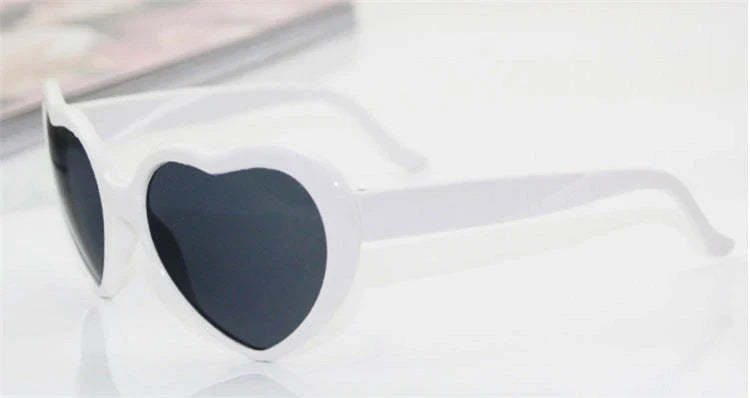 Stylish heart-shaped sunglasses with unique lens design that transforms light into enchanting special effects