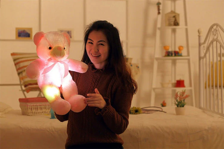 A soft and cuddly teddy bear plush toy with captivating color-changing LED lights, perfect for bringing wonder and delight to a child's room.