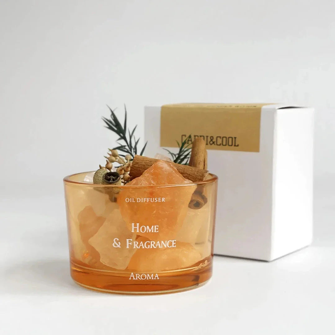 Natural stone essential oil diffuser with decorative flowers and plants, creating a calm and tranquil atmosphere in the home.