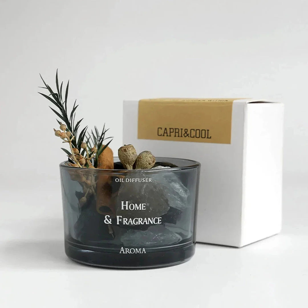 Natural stone essential oil diffuser with decorative flowers and plants, creating a calm and tranquil atmosphere in the home.