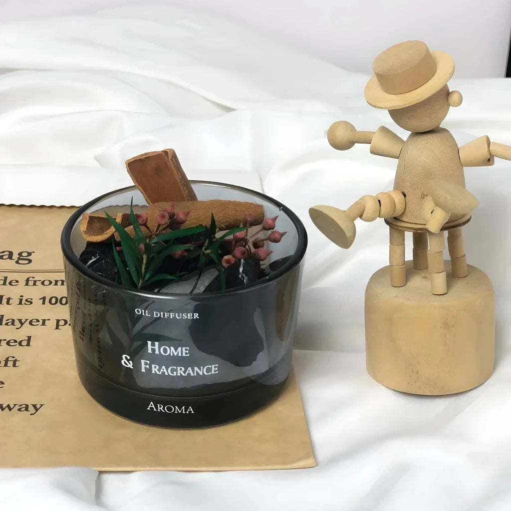 Natural stone essential oil diffuser with decorative flowers and plants, creating a calm and tranquil atmosphere in the home.