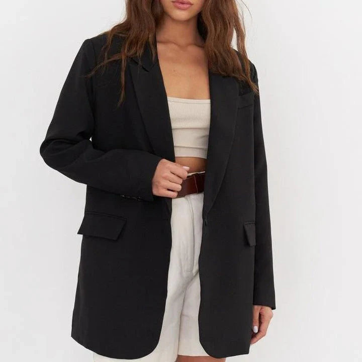 Women's oversized blazer in khaki color, featuring a classic design with a subtle button detail for a sophisticated look.