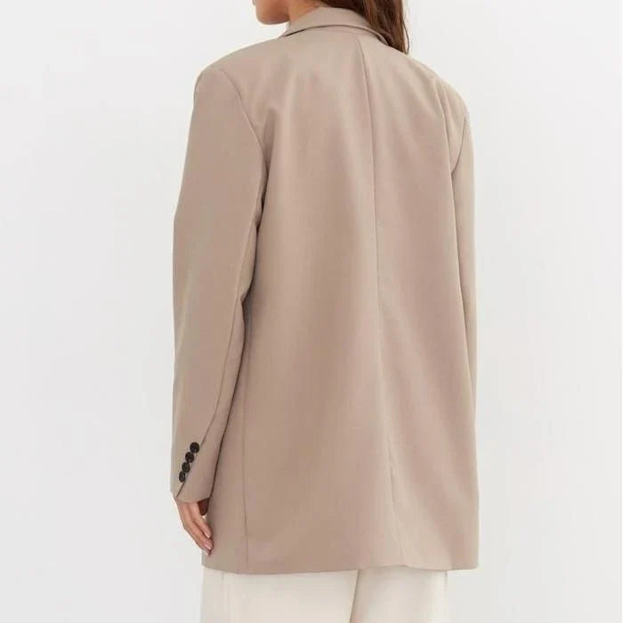Women's oversized blazer in khaki color, featuring a classic design with a subtle button detail for a sophisticated look.