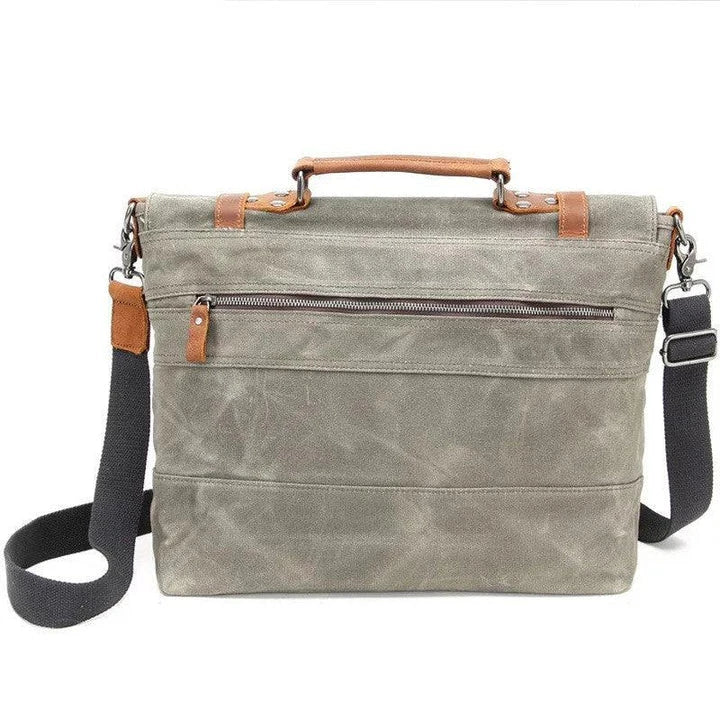 Overflowing canvas retro style men's shoulder bag in khaki colour with adjustable strap and multiple internal pockets
