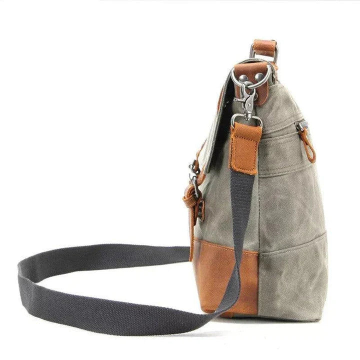 Overflowing canvas retro style men's shoulder bag in khaki colour with adjustable strap and multiple internal pockets