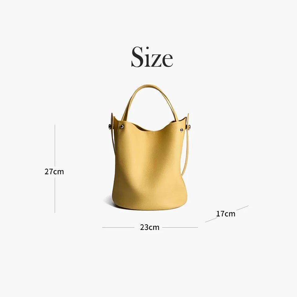 Luxurious genuine leather bucket shoulder bag with adjustable strap and interior pockets, perfect for British women's everyday use
