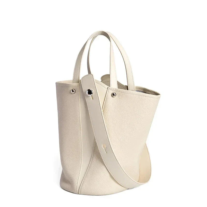 Luxurious genuine leather bucket shoulder bag with adjustable strap and interior pockets, perfect for British women's everyday use