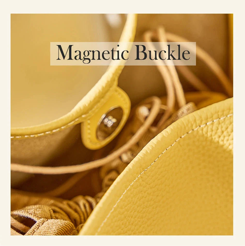 Luxurious genuine leather bucket shoulder bag with adjustable strap and interior pockets, perfect for British women's everyday use