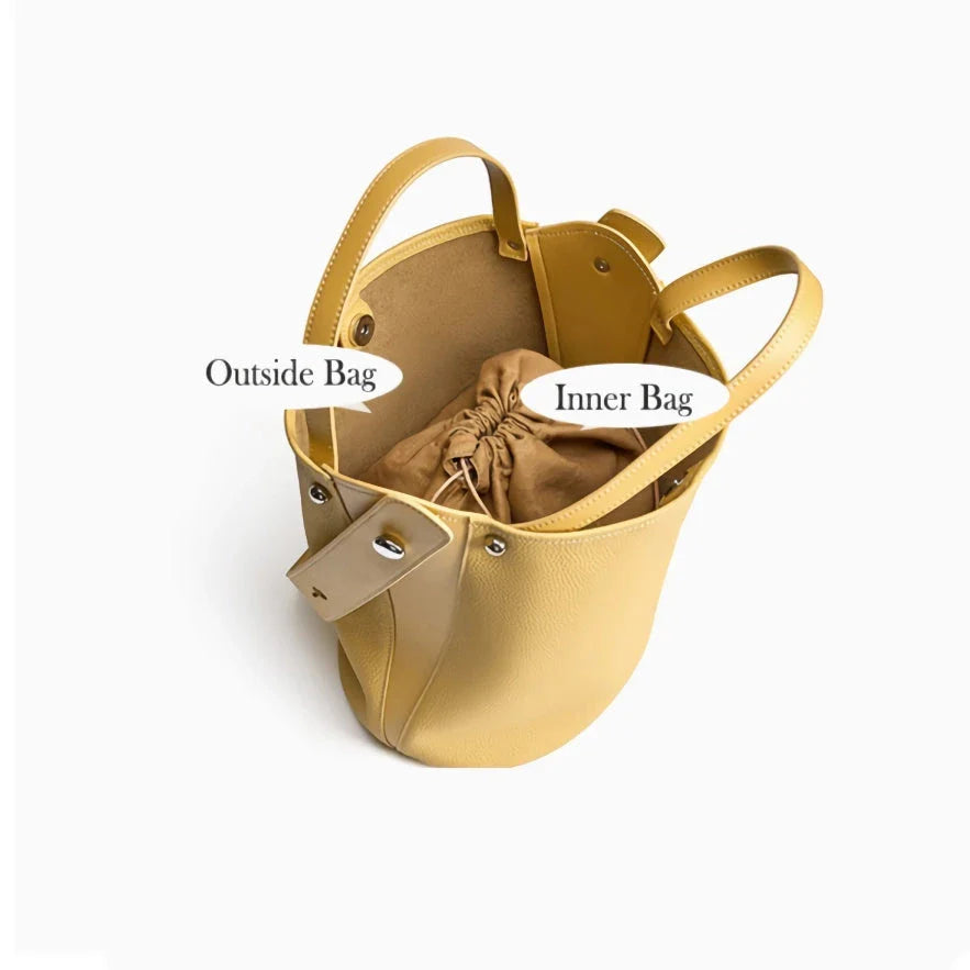 Luxurious genuine leather bucket shoulder bag with adjustable strap and interior pockets, perfect for British women's everyday use