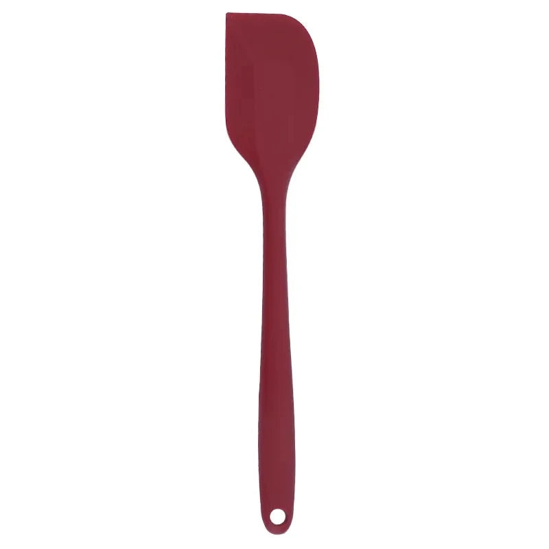 A vibrant red silicone baking spatula with an ergonomic handle and double-sided arc design, perfect for a variety of cooking and baking tasks.