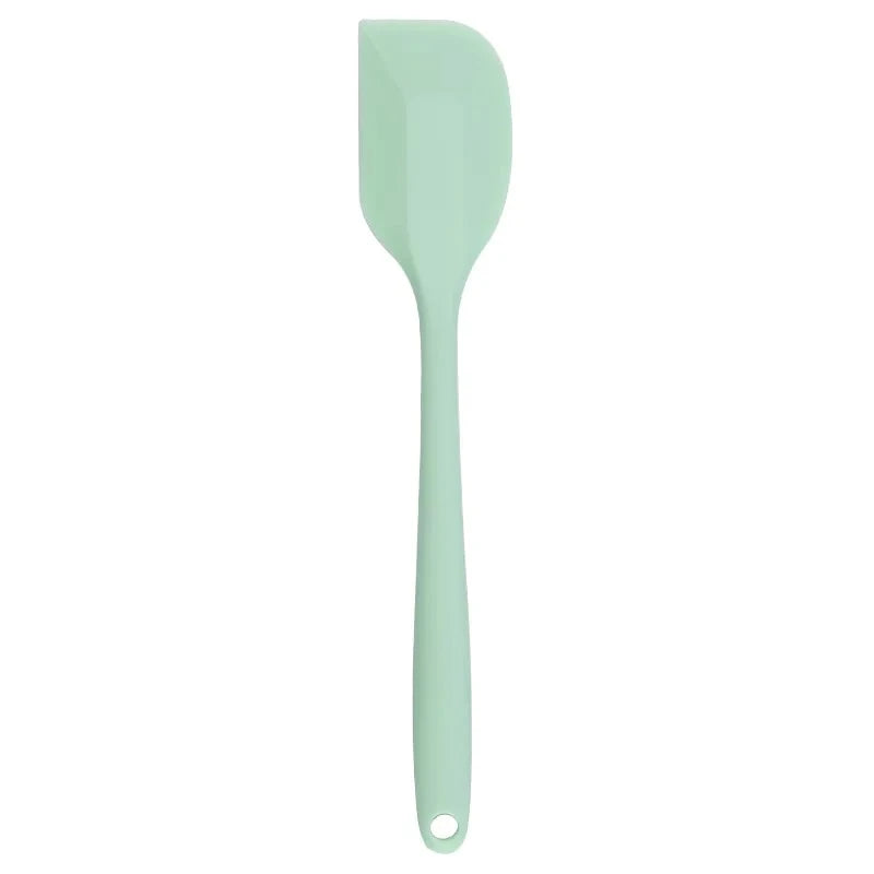 A vibrant red silicone baking spatula with an ergonomic handle and double-sided arc design, perfect for a variety of cooking and baking tasks.