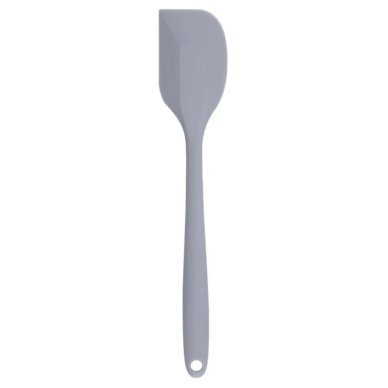 A vibrant red silicone baking spatula with an ergonomic handle and double-sided arc design, perfect for a variety of cooking and baking tasks.