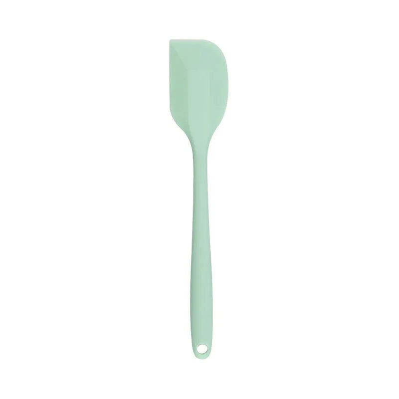 A vibrant red silicone baking spatula with an ergonomic handle and double-sided arc design, perfect for a variety of cooking and baking tasks.