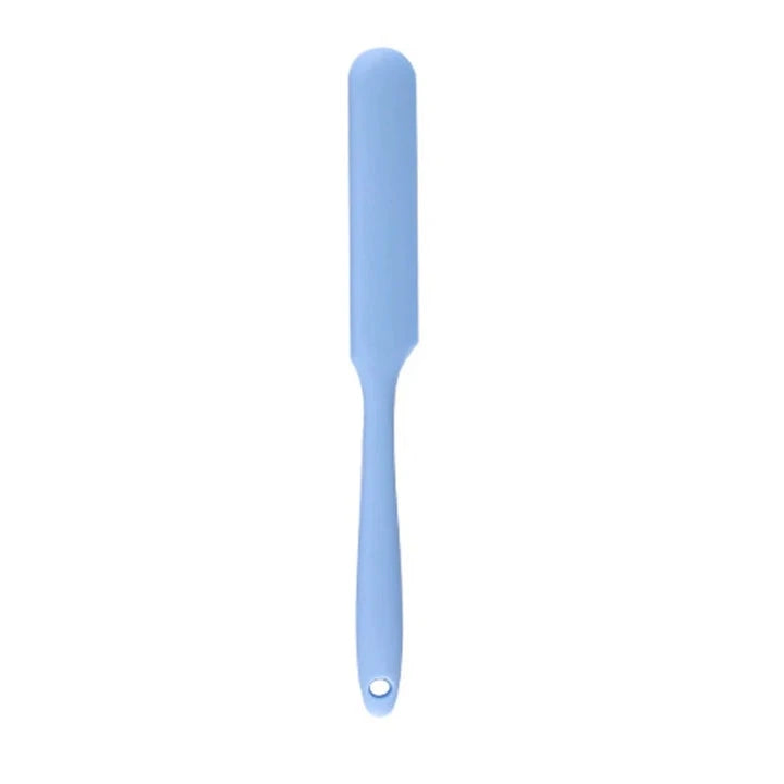 A vibrant red silicone baking spatula with an ergonomic handle and double-sided arc design, perfect for a variety of cooking and baking tasks.