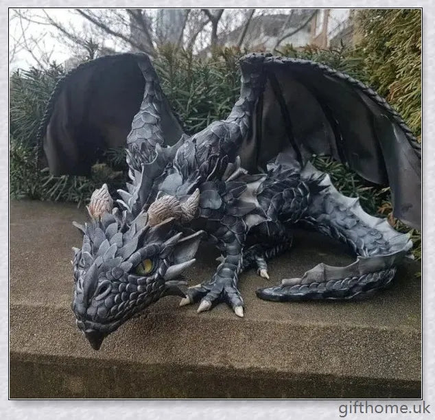 Large handmade resin and metal squatting dragon sculpture, with a mysterious and enchanting design that brings delight to indoor and outdoor spaces.