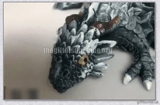 Large handmade resin and metal squatting dragon sculpture, with a mysterious and enchanting design that brings delight to indoor and outdoor spaces.
