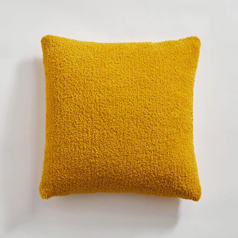Cosy plush sofa cushion cover made of soft and fluffy microfibre material in a solid yellow colour