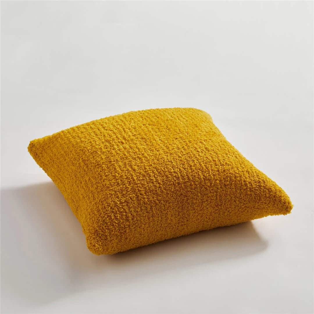Cosy plush sofa cushion cover made of soft and fluffy microfibre material in a solid yellow colour