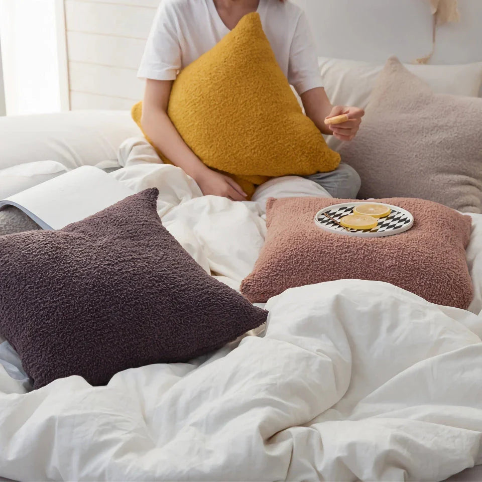 Cosy plush sofa cushion cover made of soft and fluffy microfibre material in a solid yellow colour