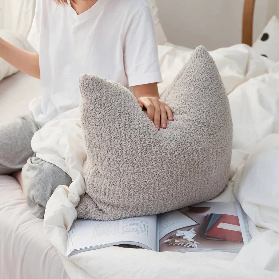 Cosy plush sofa cushion cover made of soft and fluffy microfibre material in a solid yellow colour