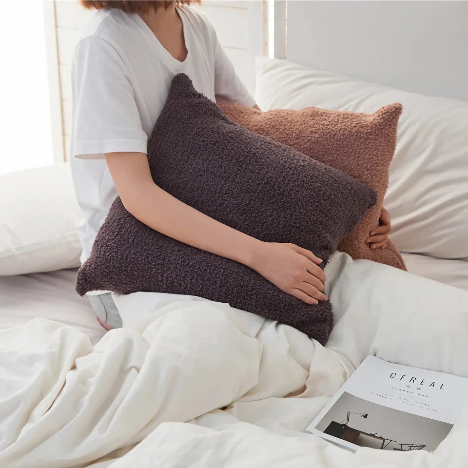 Cosy plush sofa cushion cover made of soft and fluffy microfibre material in a solid yellow colour