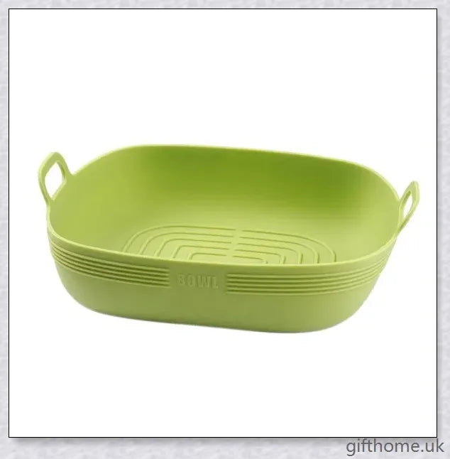 Silicone air fryer bowl in yellow and green colours, featuring square and round shapes for versatile cooking