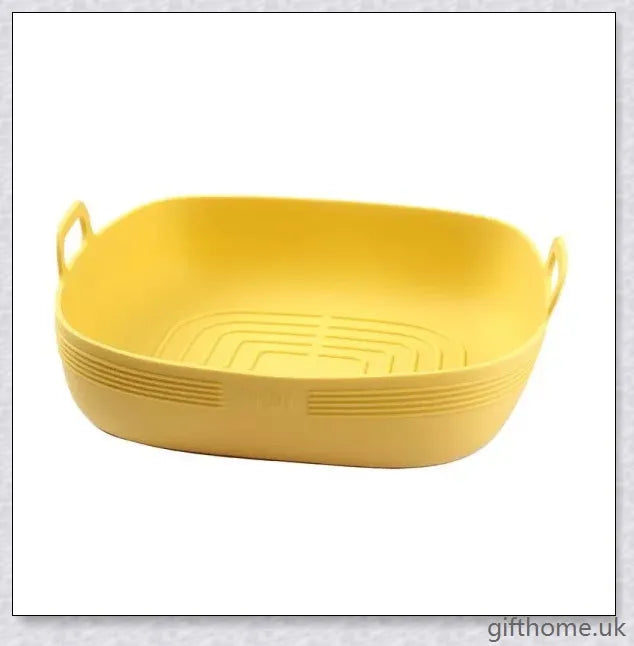 Silicone air fryer bowl in yellow and green colours, featuring square and round shapes for versatile cooking