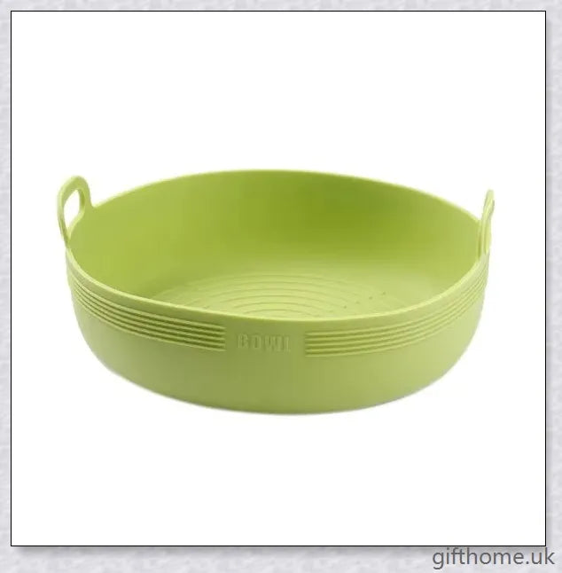 Silicone air fryer bowl in yellow and green colours, featuring square and round shapes for versatile cooking