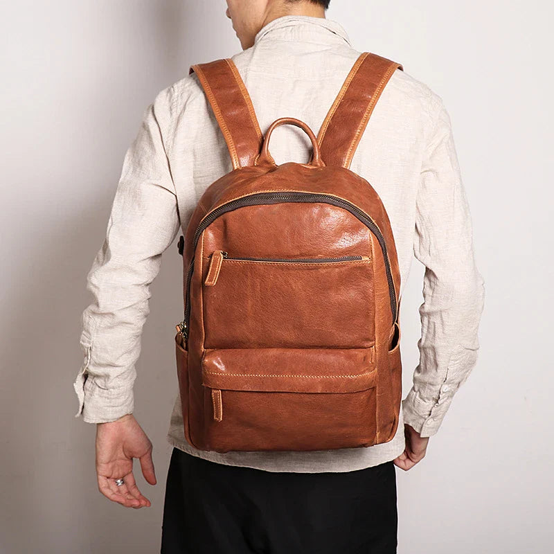Trendha Men's Leather 14-inch Computer Backpack in Black and Retro Brown colours, featuring a spacious main compartment, laptop sleeve, and multiple pockets for organised storage.